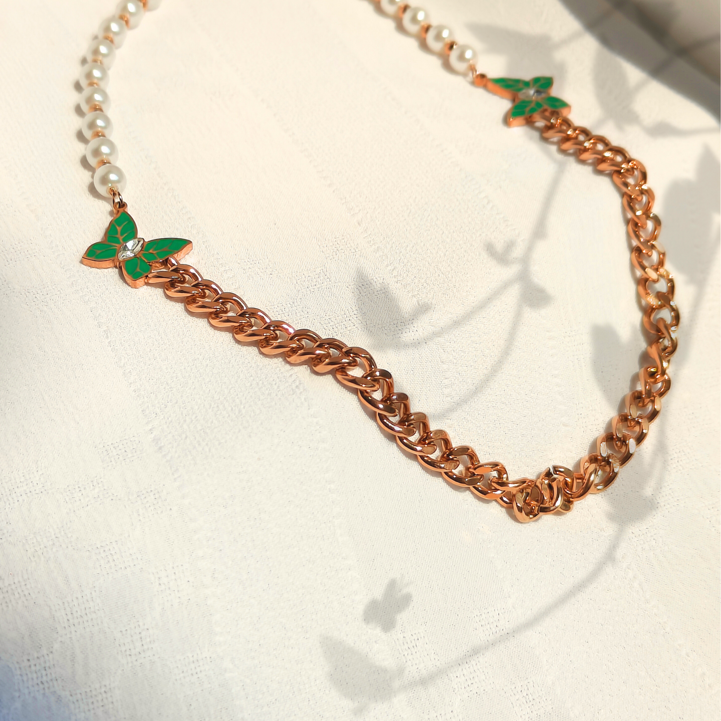 Pearl Butterfly Anti-tarnish Necklace top side view shot in natural light and shadow