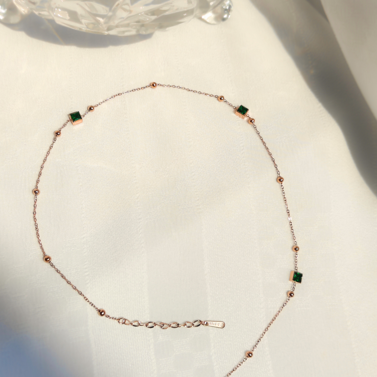 Emerald Enclave Linked Anti-tarnish Necklace in natural lighting top view