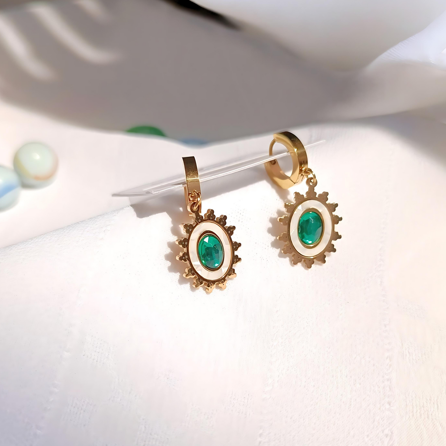 Emerald Sun Anti-tarnish Earrings side top view, sunlight falling on it 