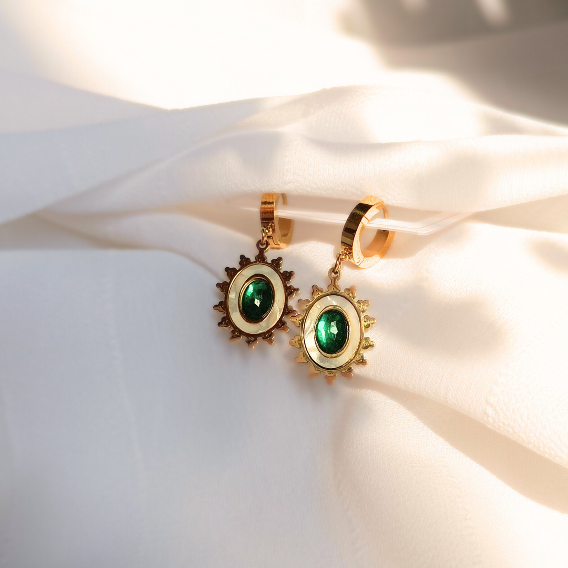 Emerald Sun Anti-tarnish Earrings in natural light surrounded with white clothes