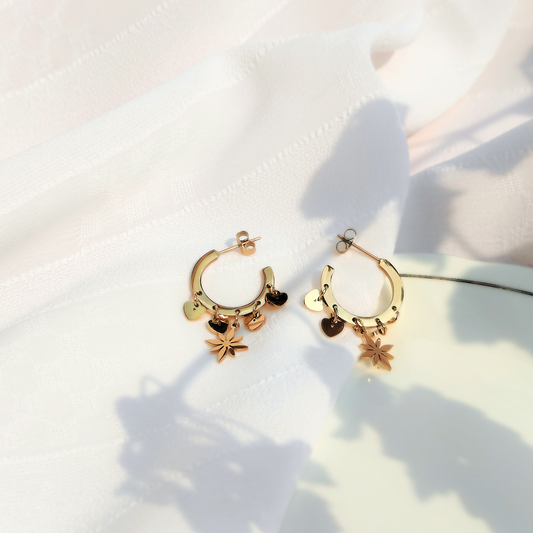 Celestial Heart Anti-tarnish Earrings in natural light with shadows, top view 