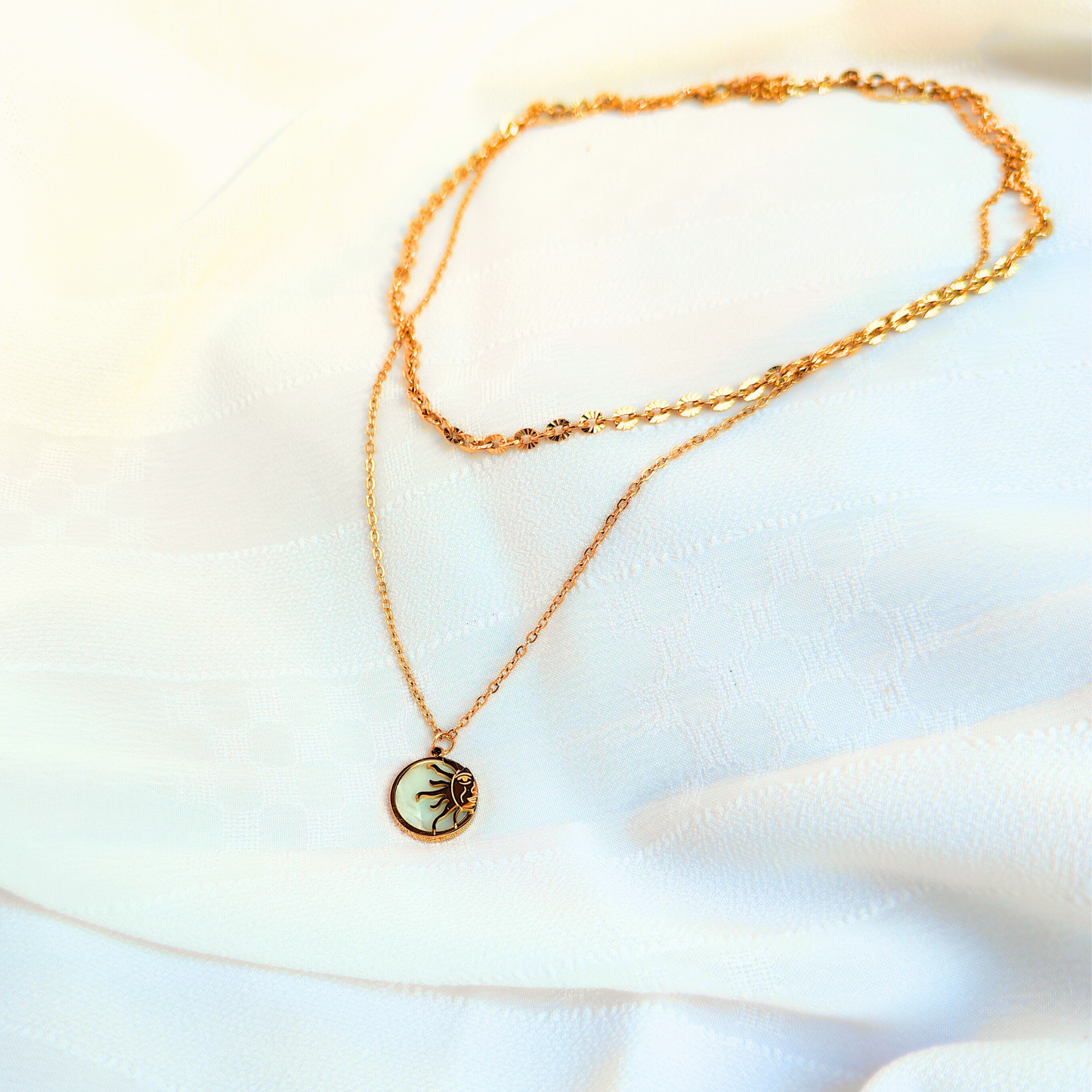 Coastal Sun Anti-tarnish Necklace, kept on a cloth, in natural light with shadows